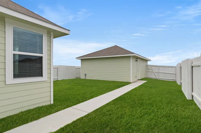 a view of a swimming pool with a garden