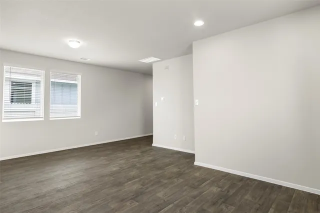 an empty room with closet area