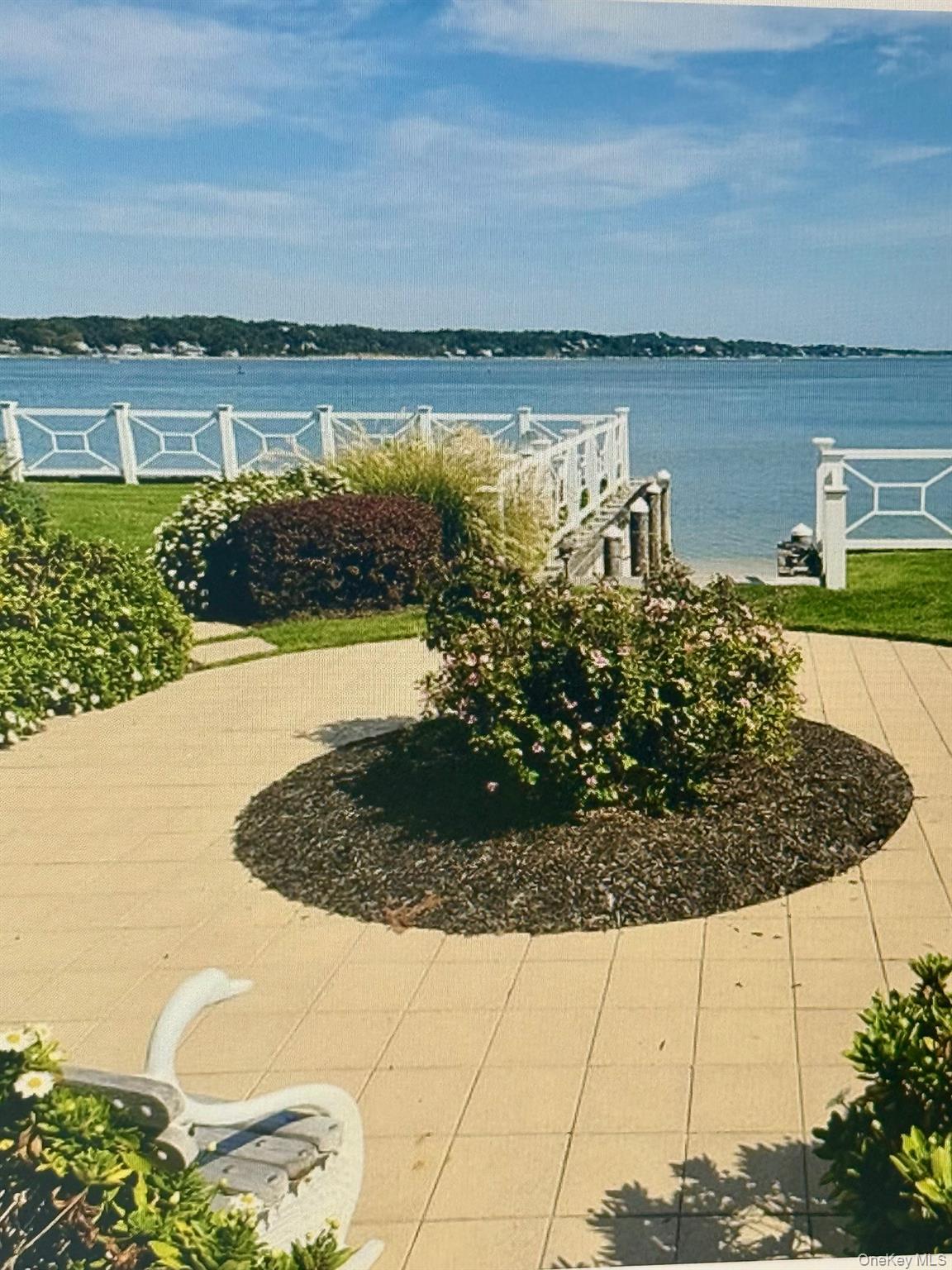 49 Canoe Place Road, Unit 212 Hampton Bays, NY 11946 - Photo 13 of 22 a view of a lake