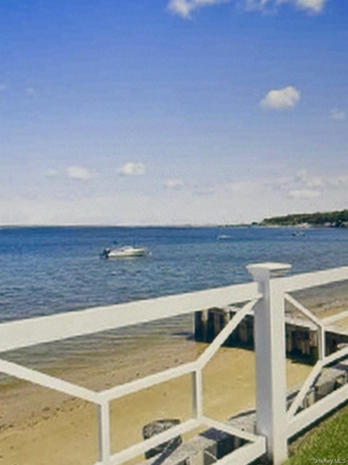 49 Canoe Place Road, Unit 212 Hampton Bays, NY 11946 - Photo 14 of 22 a view of an ocean and beach