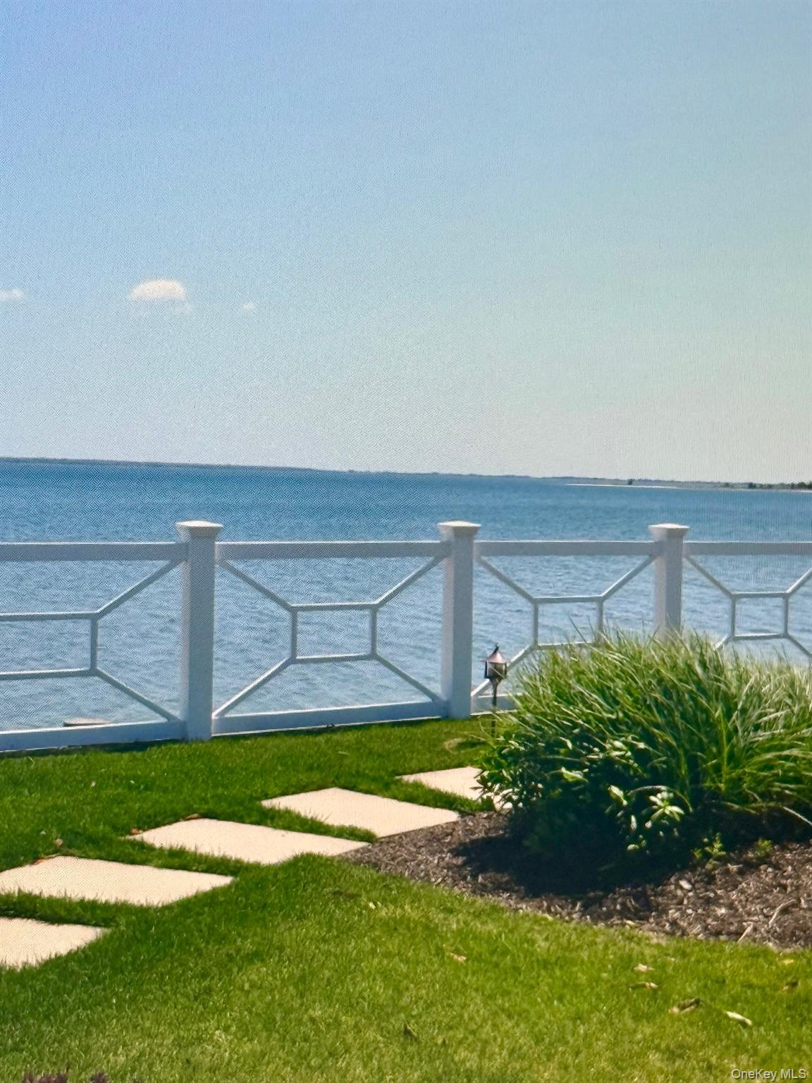 49 Canoe Place Road, Unit 212 Hampton Bays, NY 11946 - Photo 16 of 22 a view of a yard