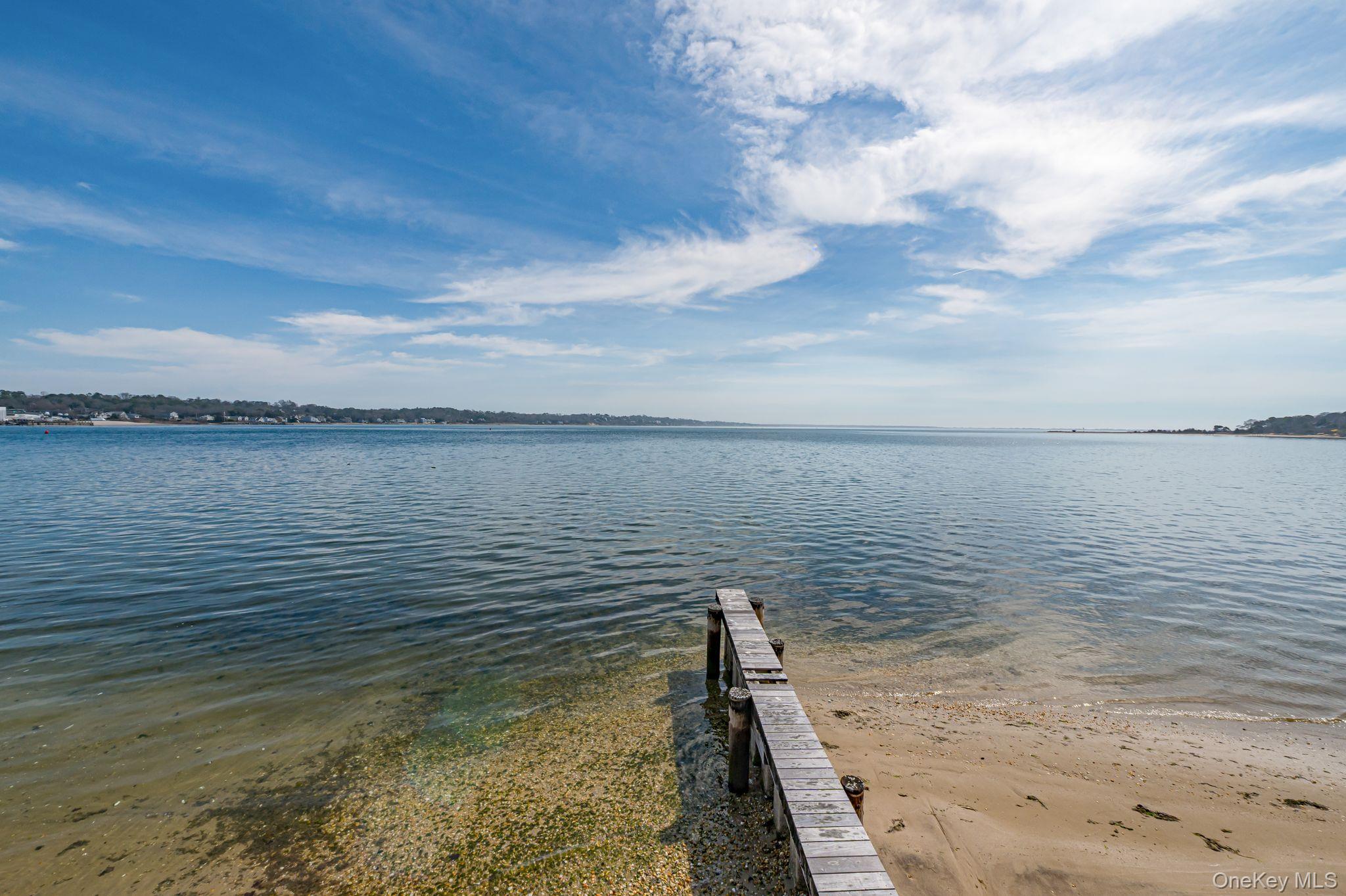 49 Canoe Place Road, Unit 212 Hampton Bays, NY 11946 - Photo 17 of 22 a view of a ocean view