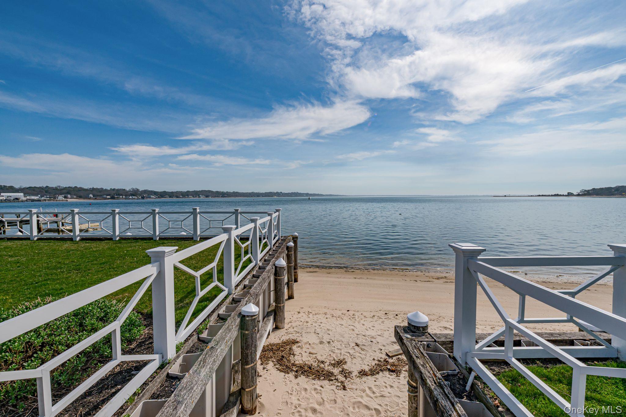 49 Canoe Place Road, Unit 212 Hampton Bays, NY 11946 - Photo 18 of 22 a view of a ocean with beach