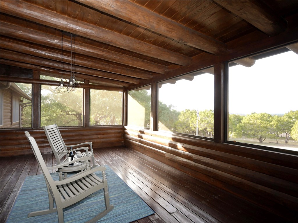 a view of two chairs in the balcony
