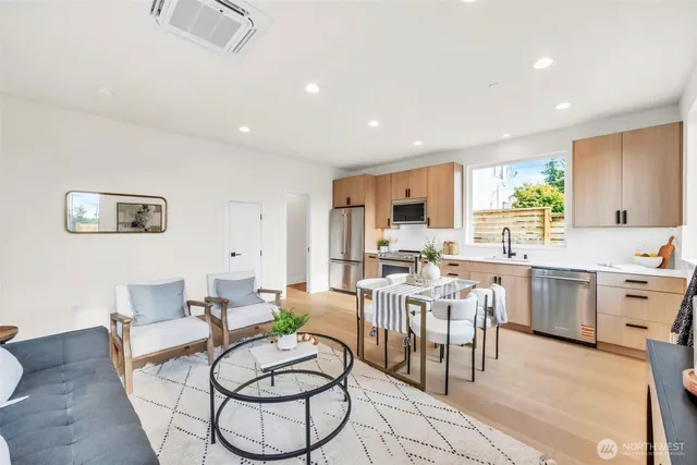 a bedroom with a large bed and a large window