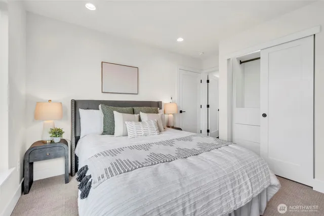 a bedroom with a bed and a couch