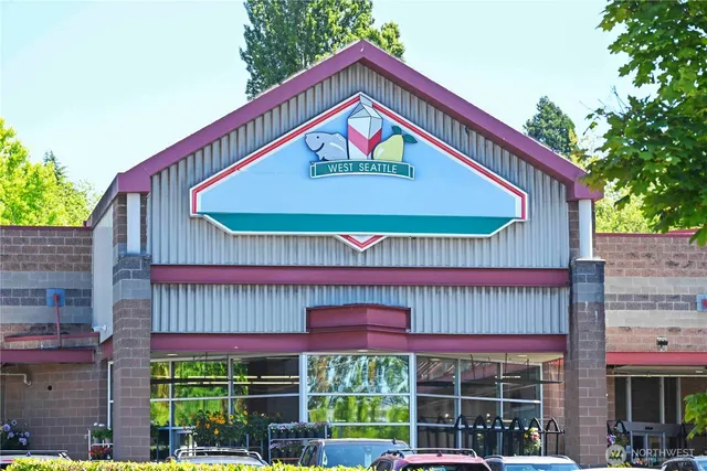 a front view of a building with parking space