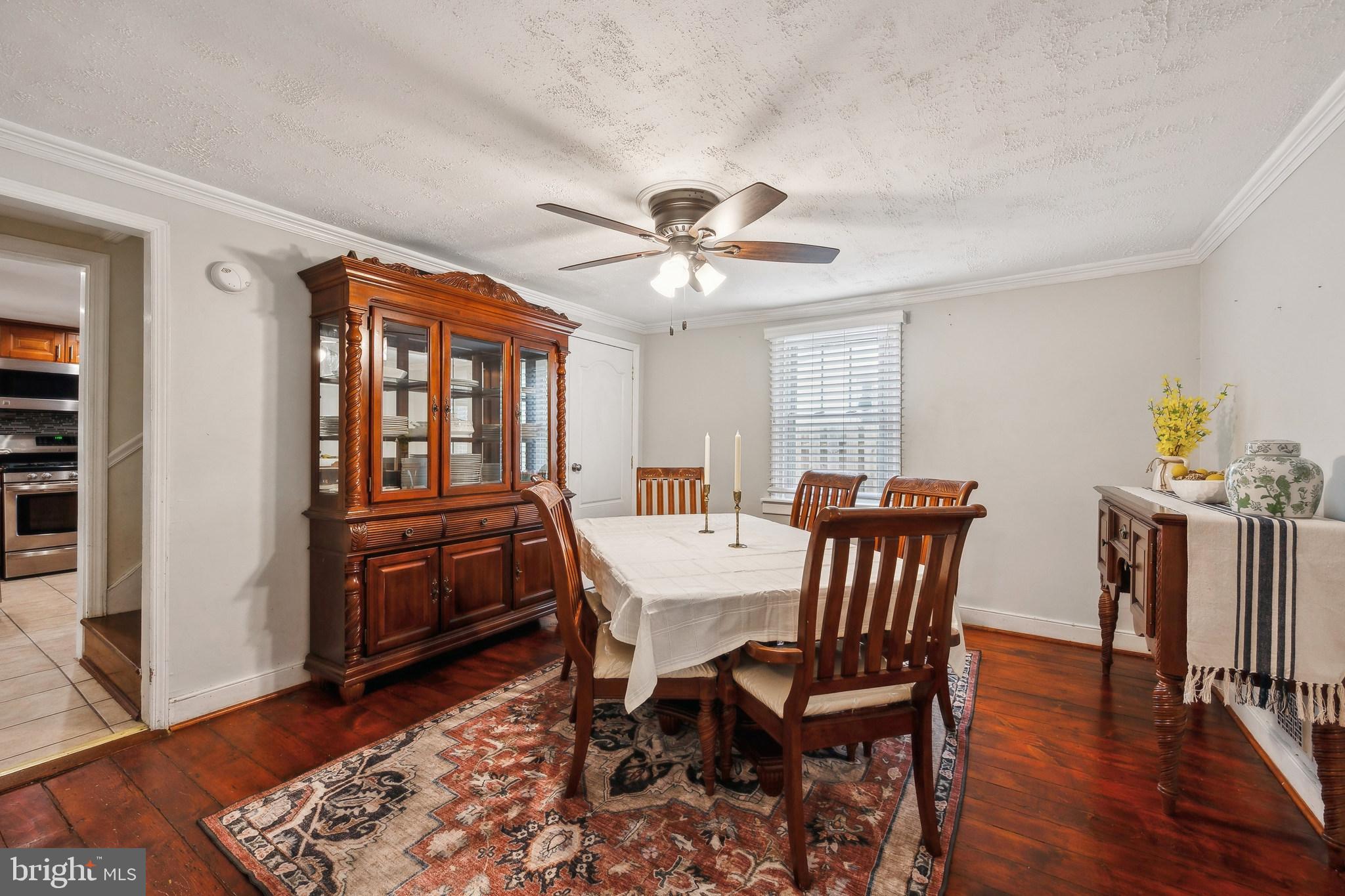 165 Warren Street Beverly, NJ 08010 - Photo 11 of 26 a view of a dining room with furniture window and wooden floor