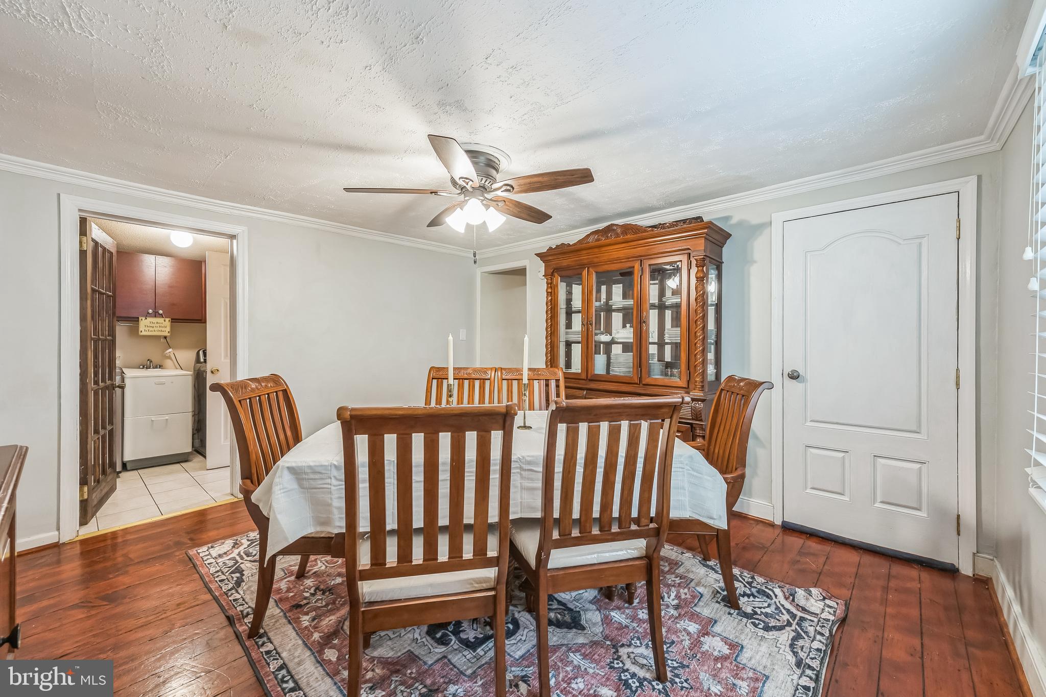 165 Warren Street Beverly, NJ 08010 - Photo 12 of 26 a view of a dining room with furniture wooden floor and a chandelier