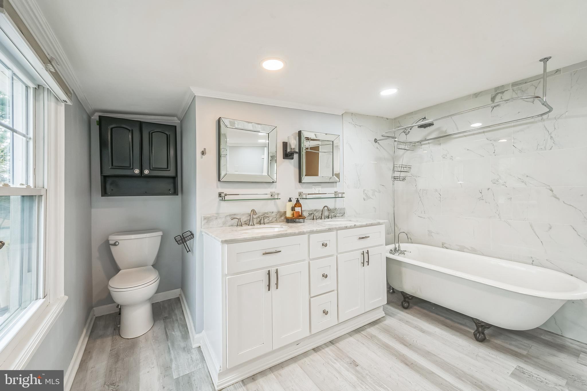 165 Warren Street Beverly, NJ 08010 - Photo 14 of 26 a bathroom with a granite countertop sink toilet and shower
