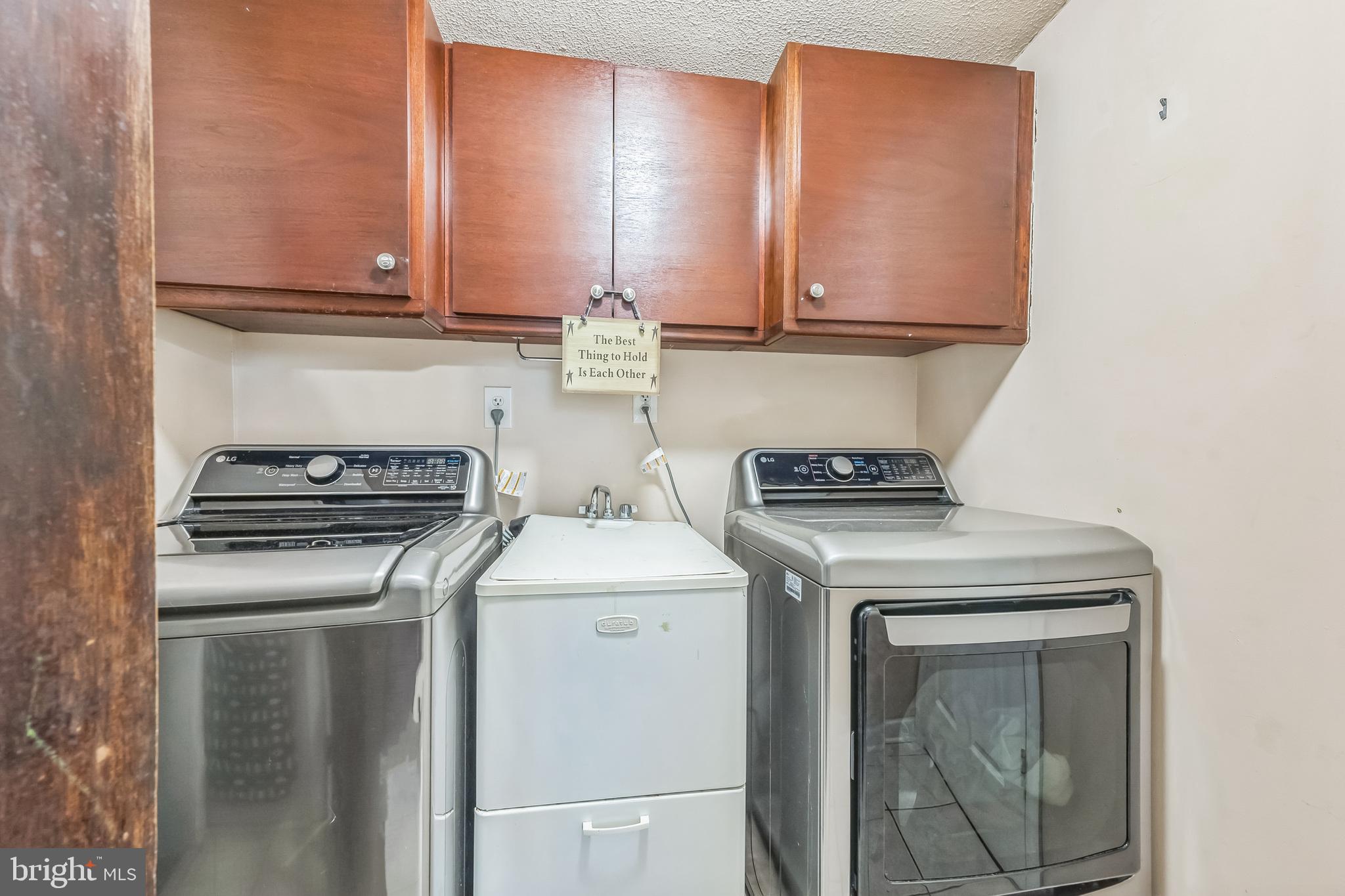 165 Warren Street Beverly, NJ 08010 - Photo 15 of 26 a kitchen with a stove and a microwave