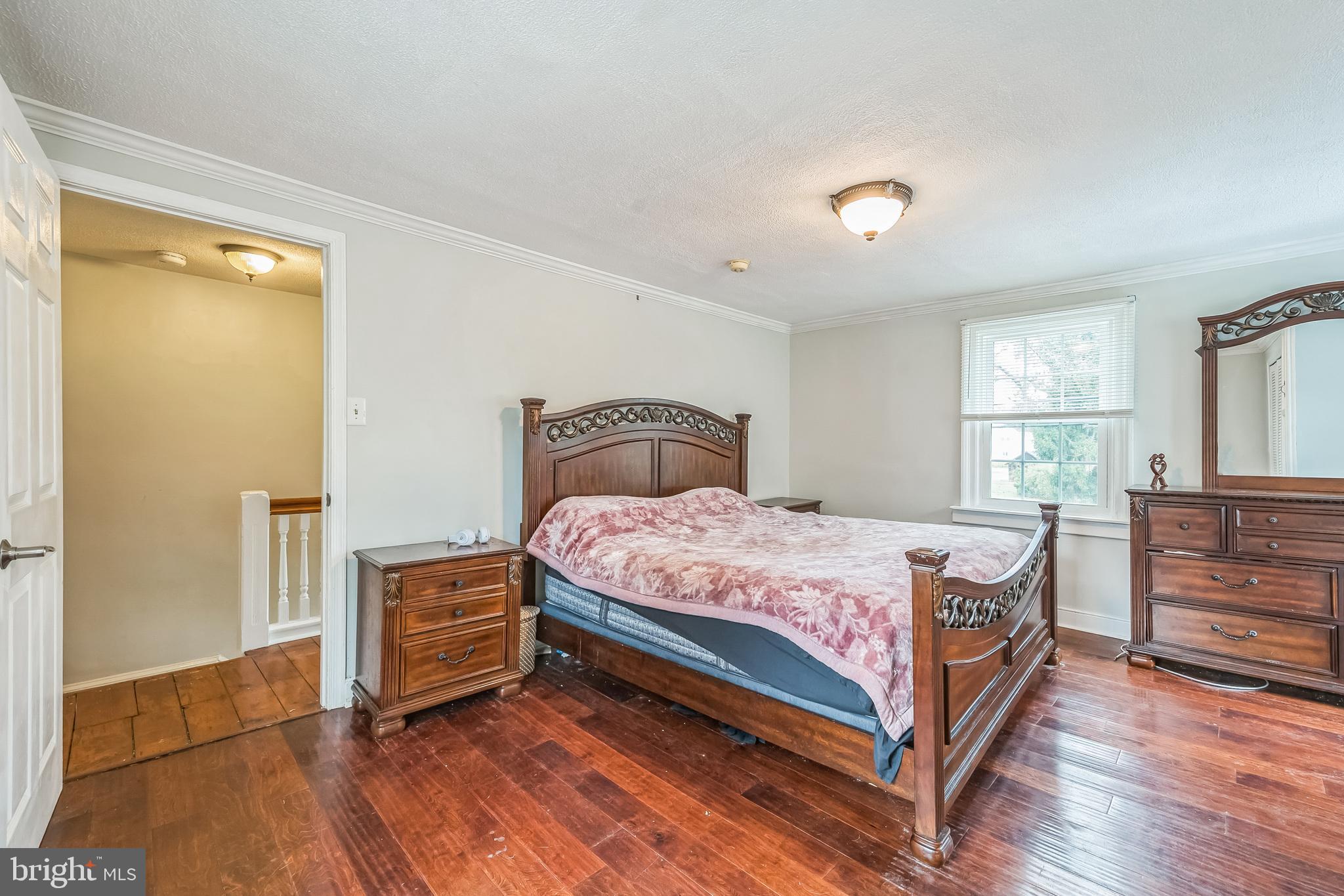 165 Warren Street Beverly, NJ 08010 - Photo 18 of 26 a bedroom with a bed and a window