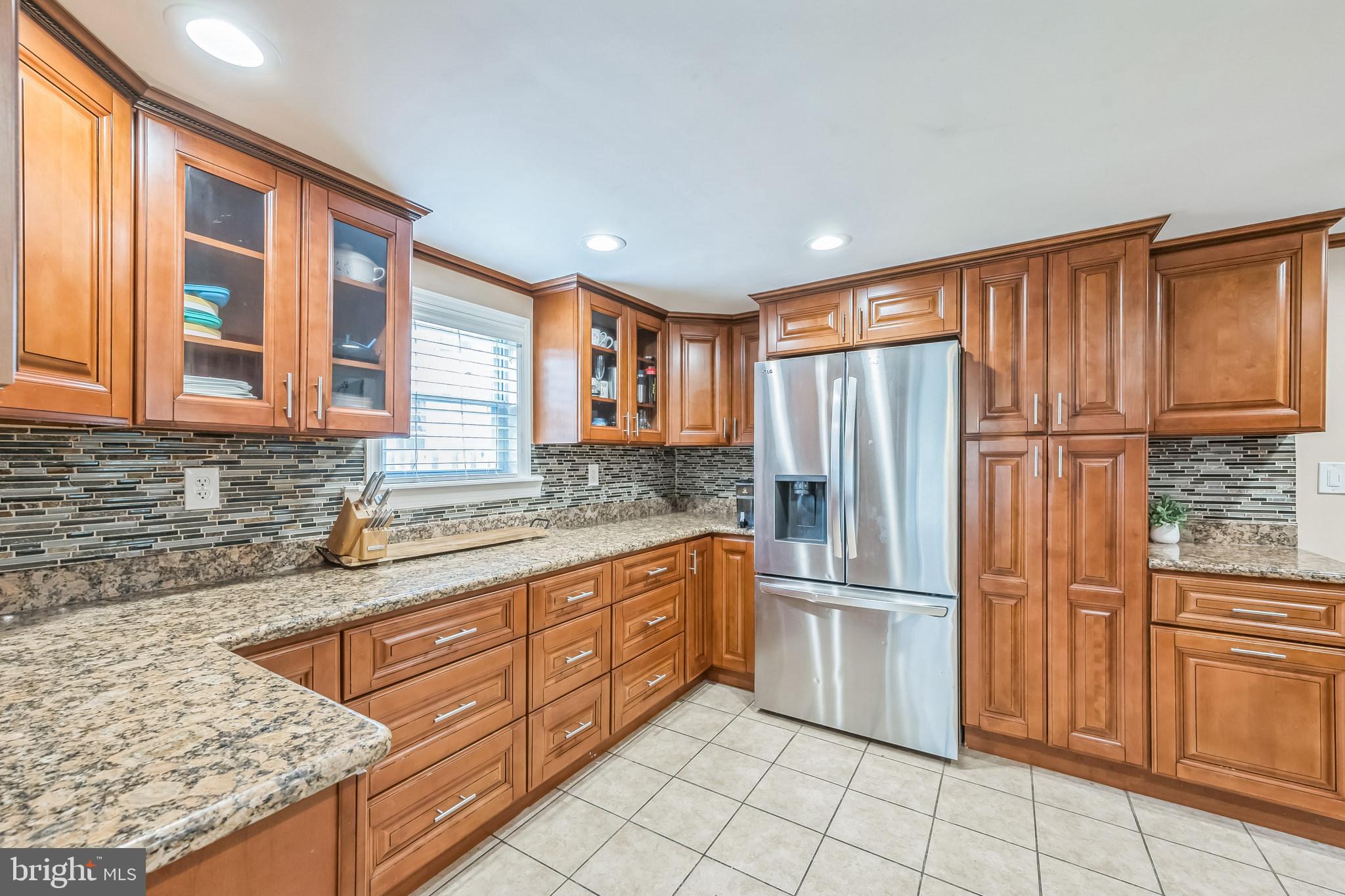 165 Warren Street Beverly, NJ 08010 - Photo 2 of 26 a kitchen with stainless steel appliances granite countertop a refrigerator and a sink