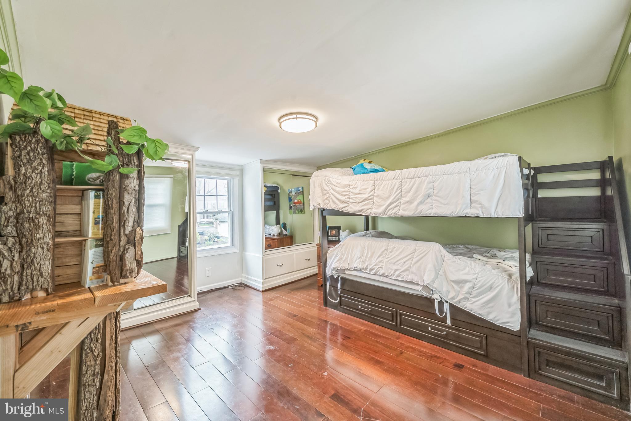 165 Warren Street Beverly, NJ 08010 - Photo 22 of 26 a bedroom with a bed and a large window with outer view