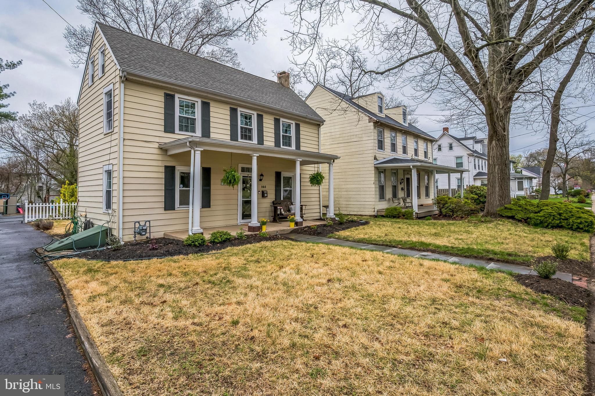 165 Warren Street Beverly, NJ 08010 - Photo 26 of 26 a front view of a house with a garden