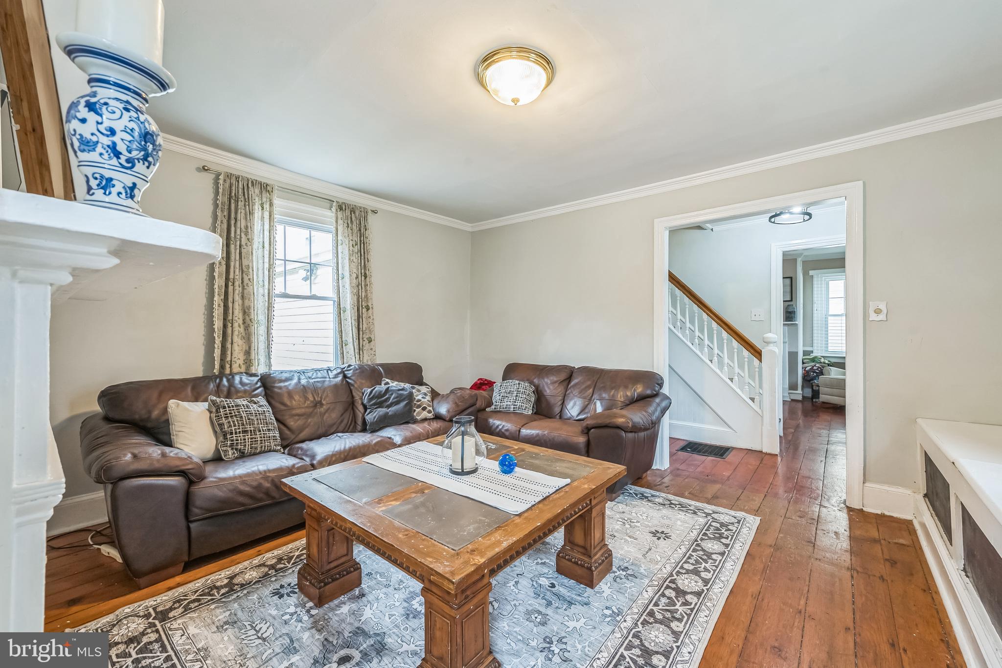 165 Warren Street Beverly, NJ 08010 - Photo 6 of 26 a living room with furniture and a rug