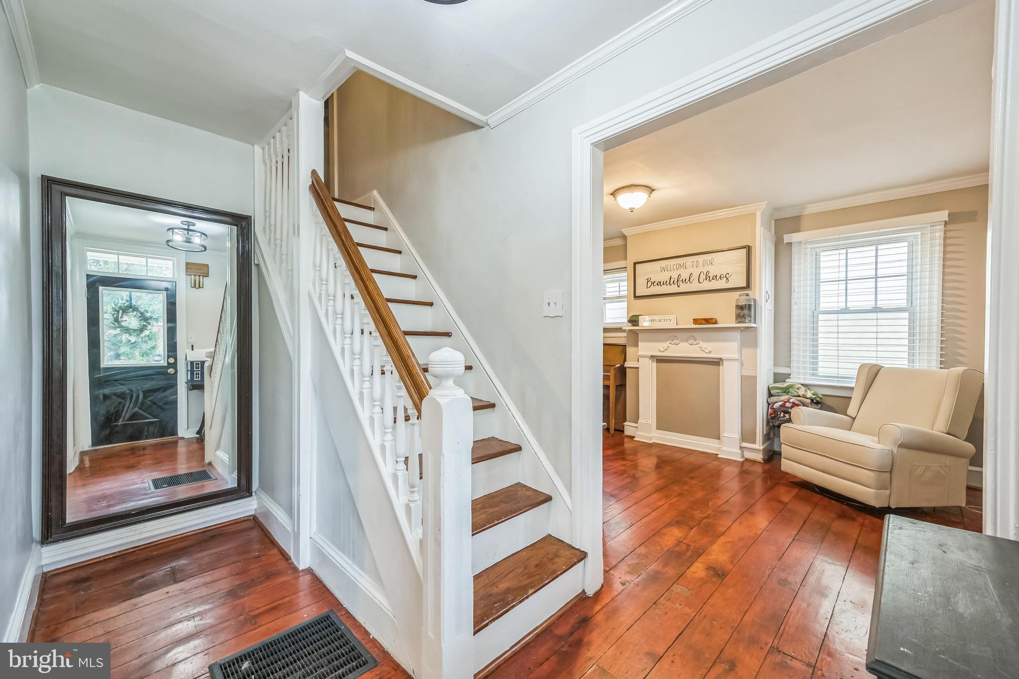 165 Warren Street Beverly, NJ 08010 - Photo 7 of 26 a view of staircase with white walls and windows