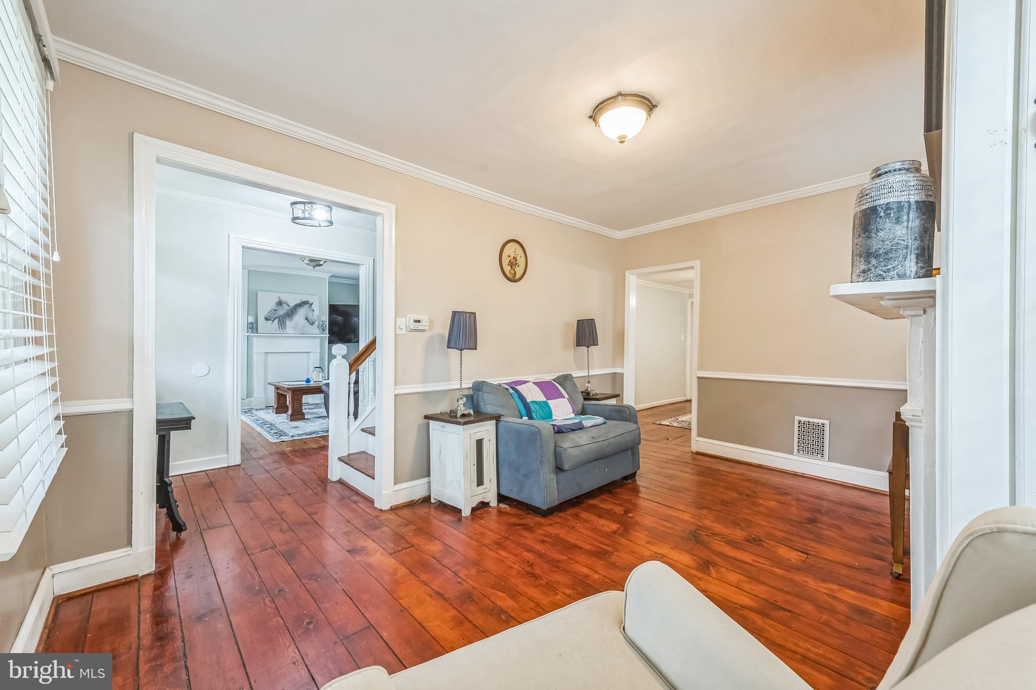 165 Warren Street Beverly, NJ 08010 - Photo 8 of 26 a living room with furniture and wooden floor