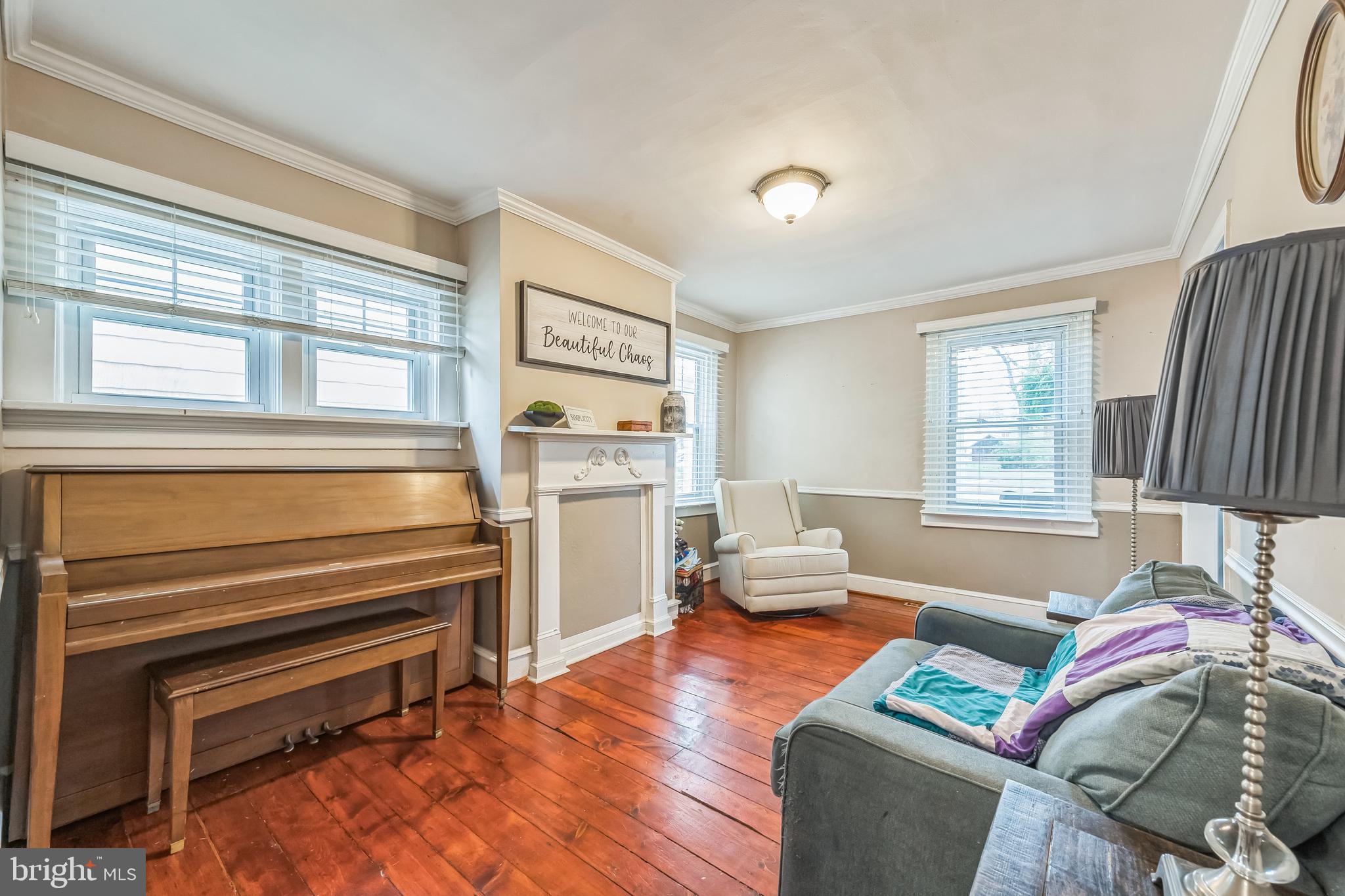 165 Warren Street Beverly, NJ 08010 - Photo 9 of 26 a living room with furniture and a window