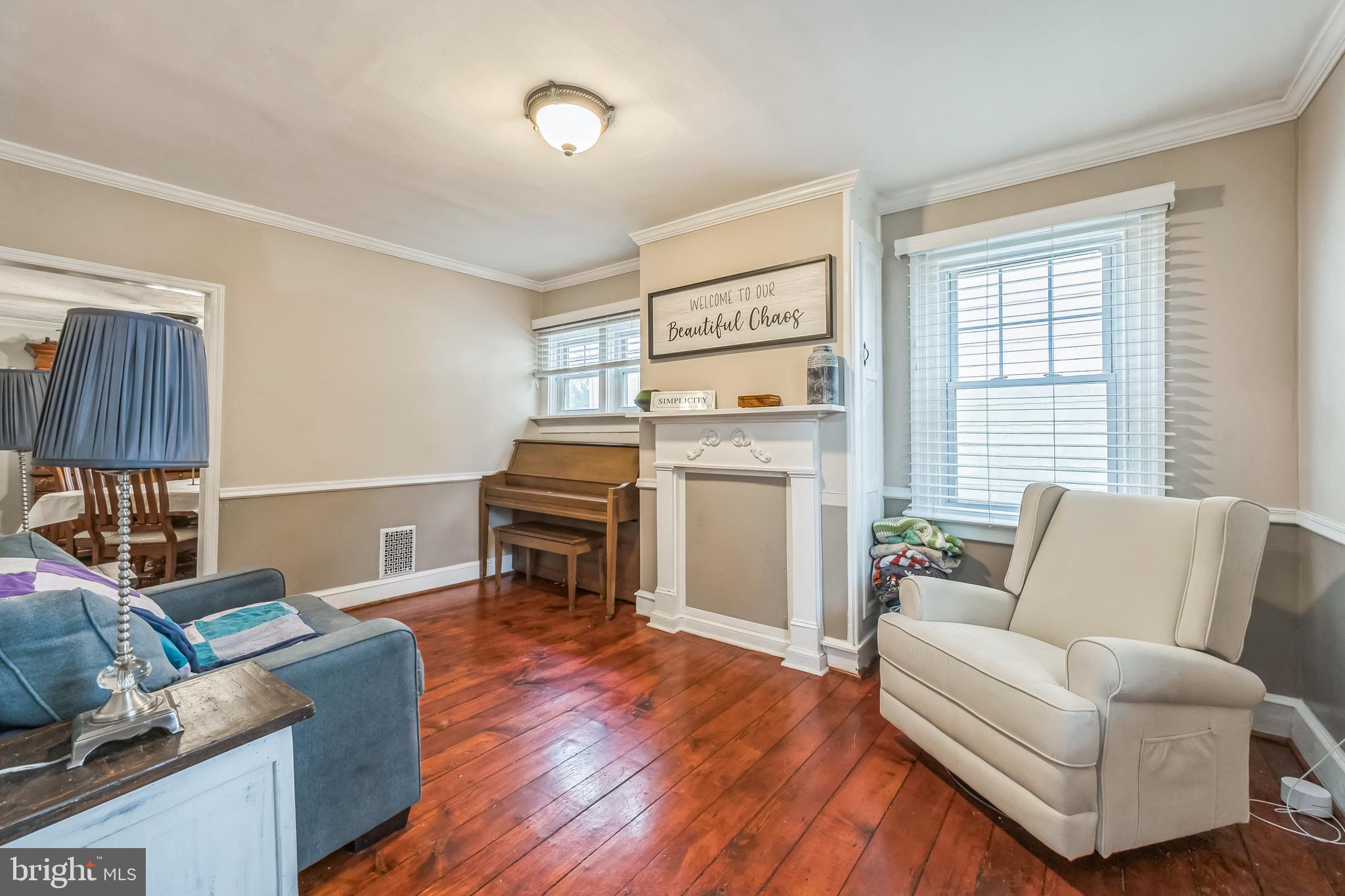 165 Warren Street Beverly, NJ 08010 - Photo 10 of 26 a living room with furniture and a wooden floor