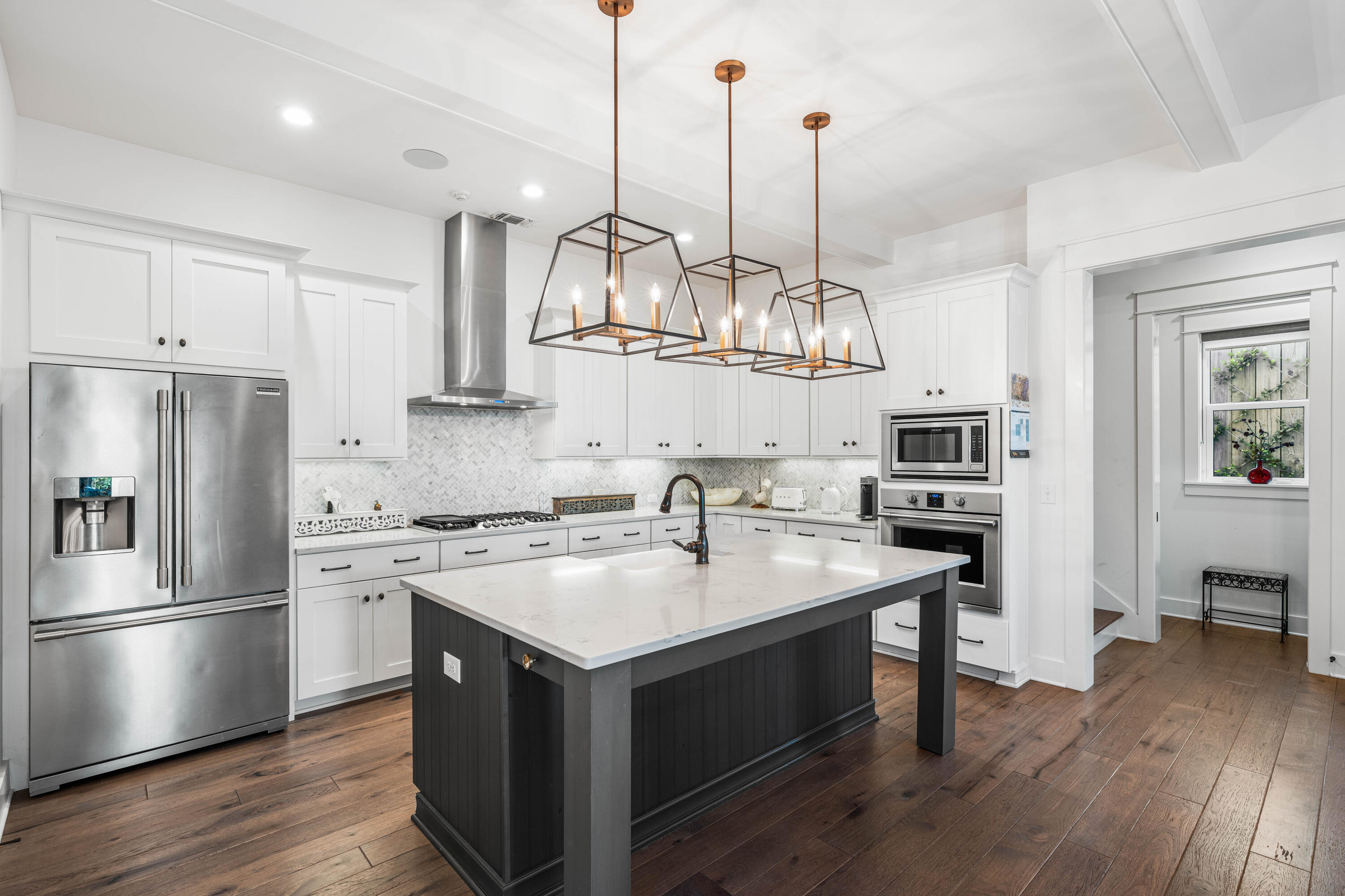 38 Ridgewalk Circle Santa Rosa Beach, FL 32459 - Photo 12 of 28 a kitchen with kitchen island granite countertop a sink a counter space appliances and cabinets