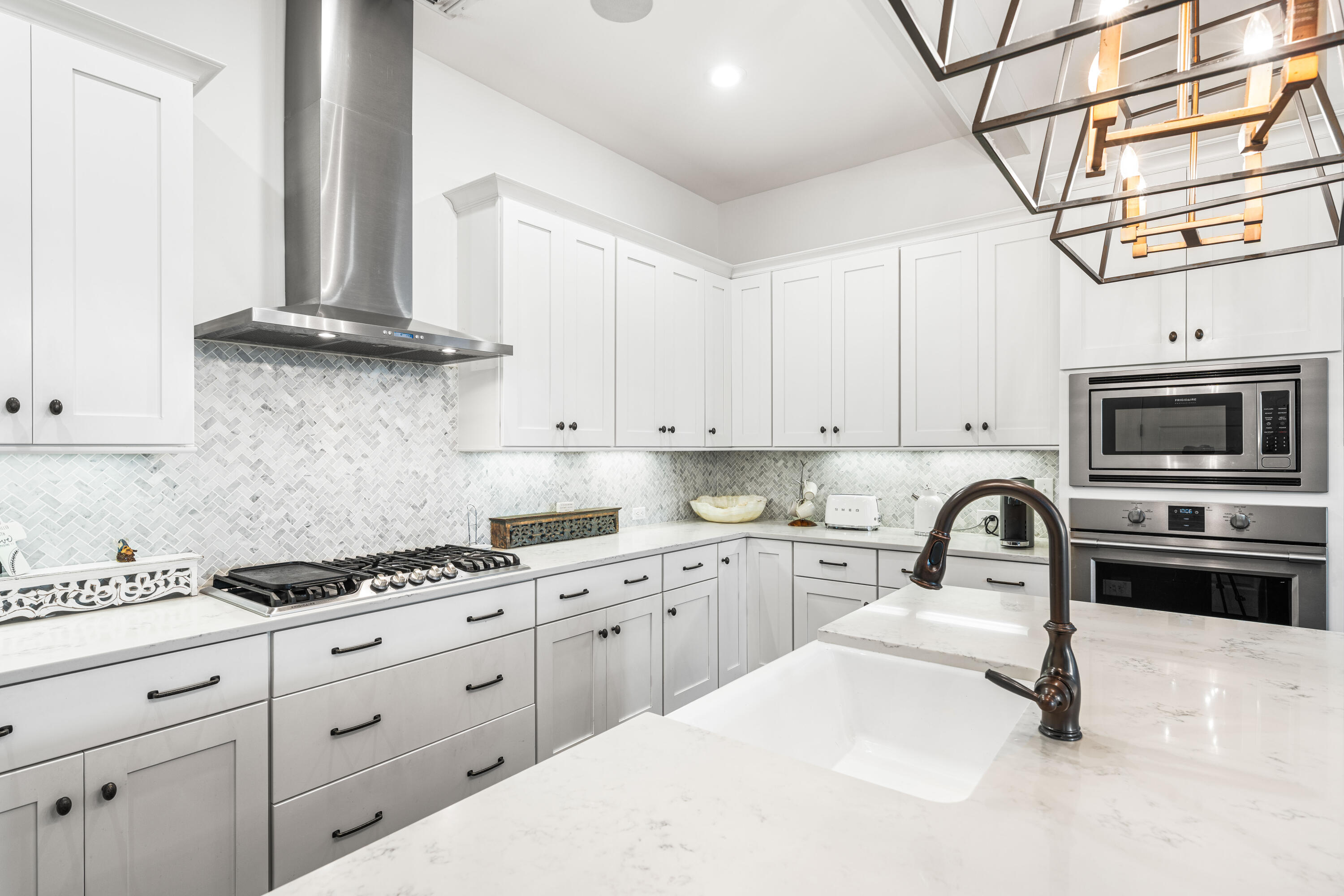 38 Ridgewalk Circle Santa Rosa Beach, FL 32459 - Photo 14 of 28 a kitchen with granite countertop a sink stainless steel appliances and white cabinets