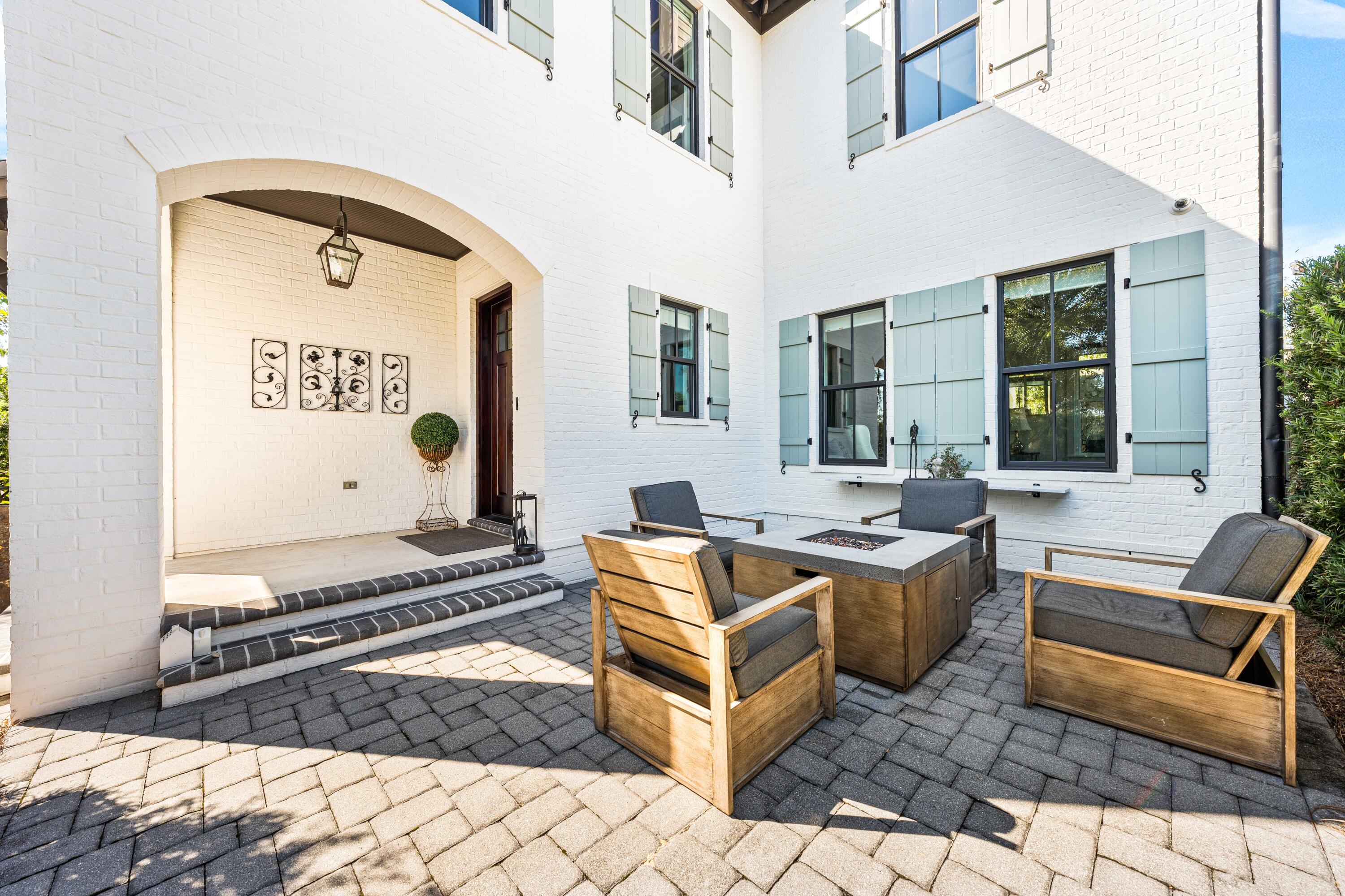 38 Ridgewalk Circle Santa Rosa Beach, FL 32459 - Photo 4 of 28 a backyard of a house with chairs and wooden floor