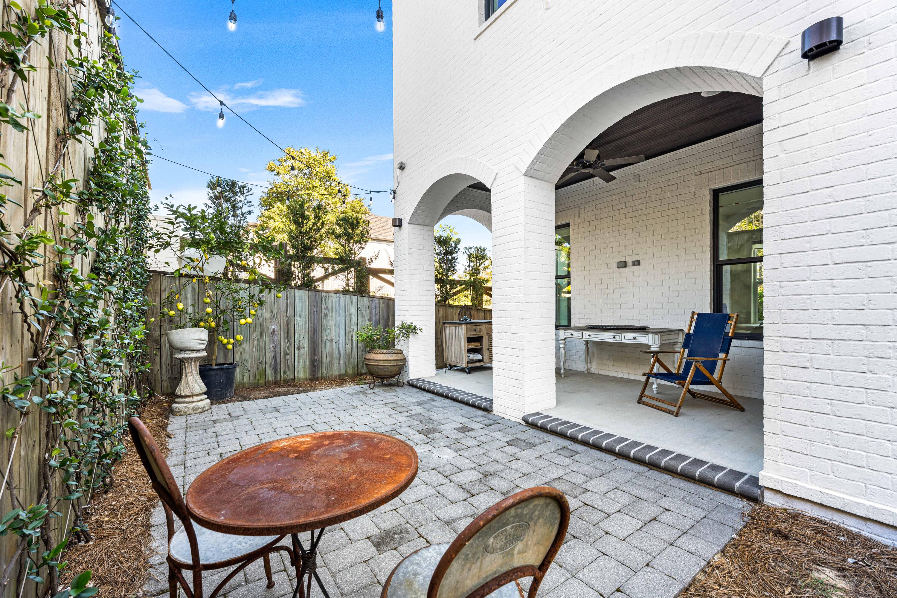 38 Ridgewalk Circle Santa Rosa Beach, FL 32459 - Photo 5 of 28 a backyard of a house with barbeque oven table and chairs