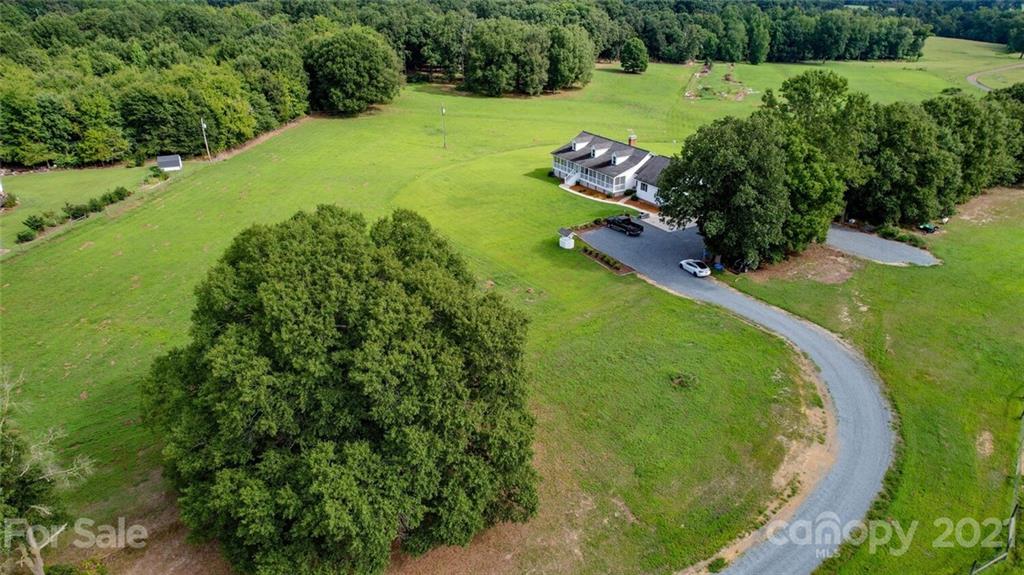 6460 Talley Road Stanfield, NC 28163 - Photo 1 of 47 an aerial view of a house with a yard