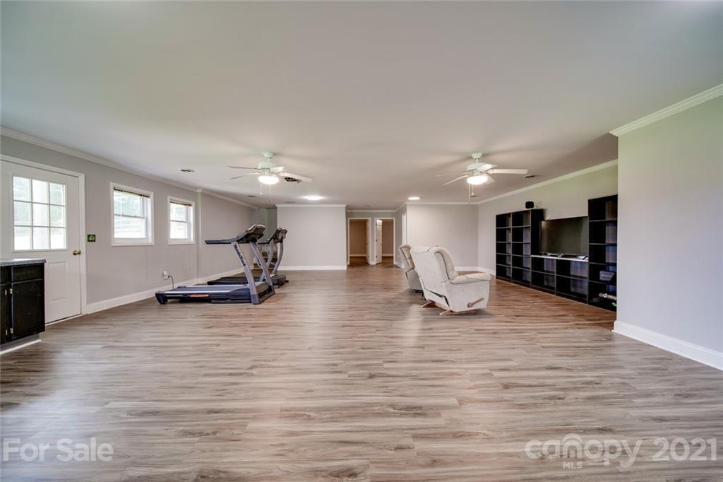 6460 Talley Road Stanfield, NC 28163 - Photo 17 of 47 a view of a room with wooden floor and furniture