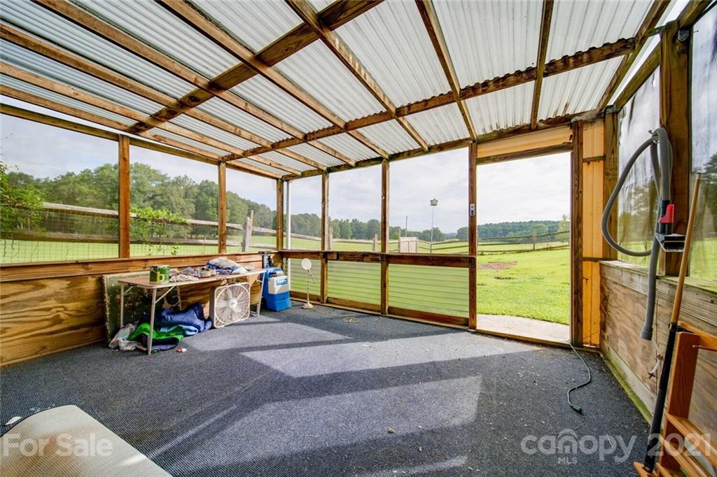 6460 Talley Road Stanfield, NC 28163 - Photo 23 of 47 a view of steet with a floor to ceiling window next to a yard