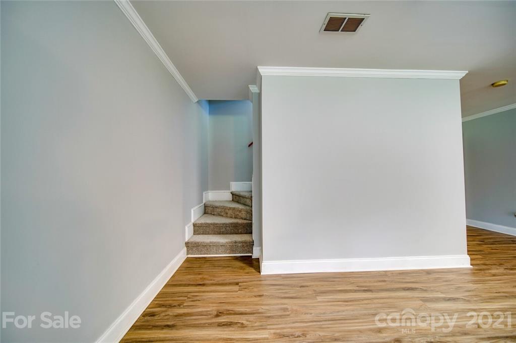 6460 Talley Road Stanfield, NC 28163 - Photo 24 of 47 a view of a hallway with wooden floor