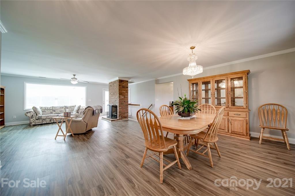 6460 Talley Road Stanfield, NC 28163 - Photo 27 of 47 a view of a dining room with furniture window and wooden floor