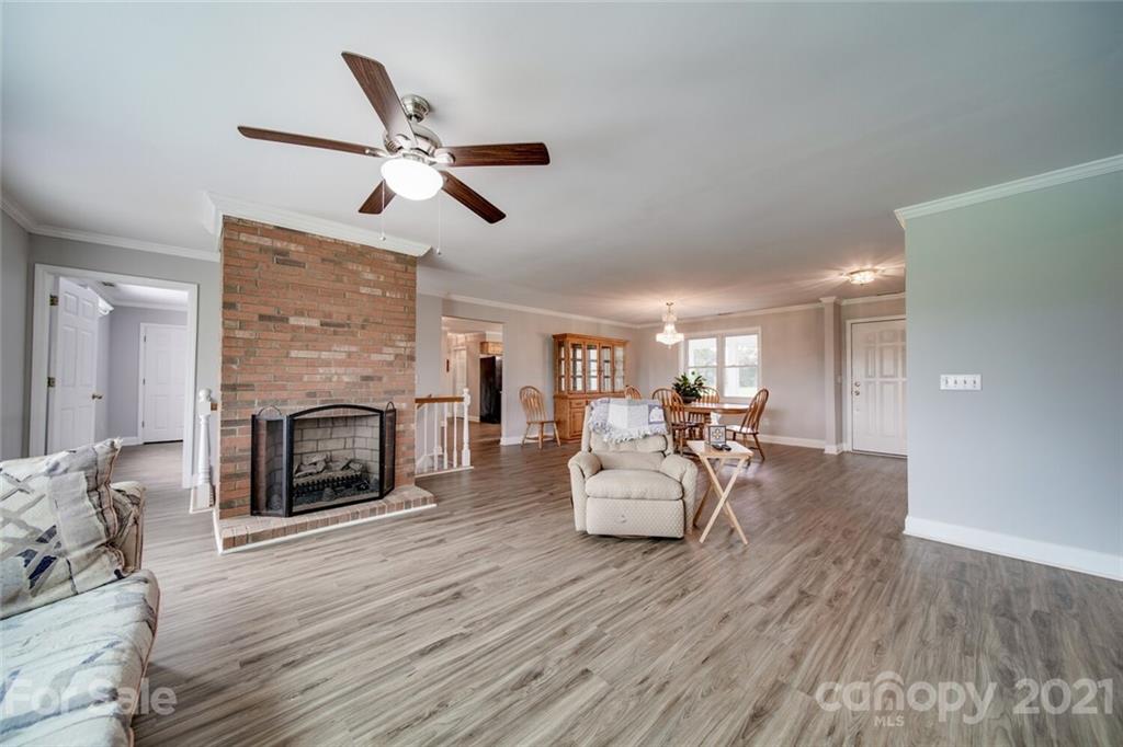 6460 Talley Road Stanfield, NC 28163 - Photo 29 of 47 a living room with furniture and a fireplace