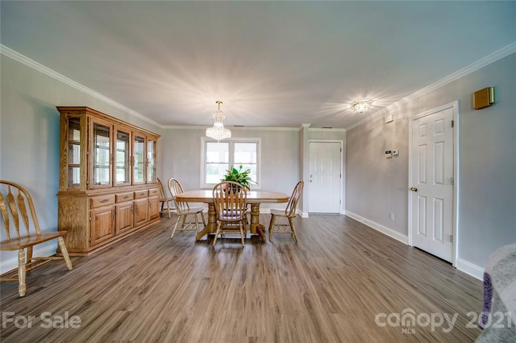 6460 Talley Road Stanfield, NC 28163 - Photo 30 of 47 a view of a dining room with furniture and wooden floor