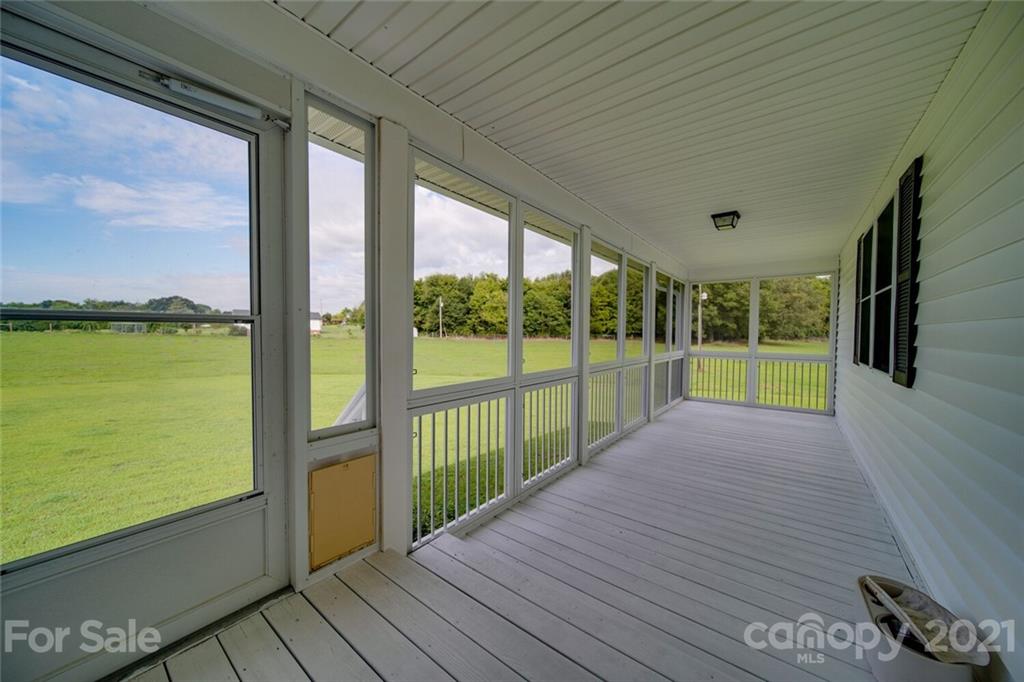 6460 Talley Road Stanfield, NC 28163 - Photo 42 of 47 a view of a balcony with wooden floor