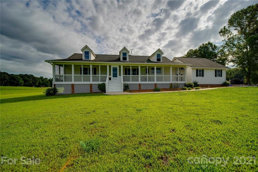 6460 Talley Road Stanfield, NC 28163 - Photo 44 of 47 a view of a house with a yard and sitting area
