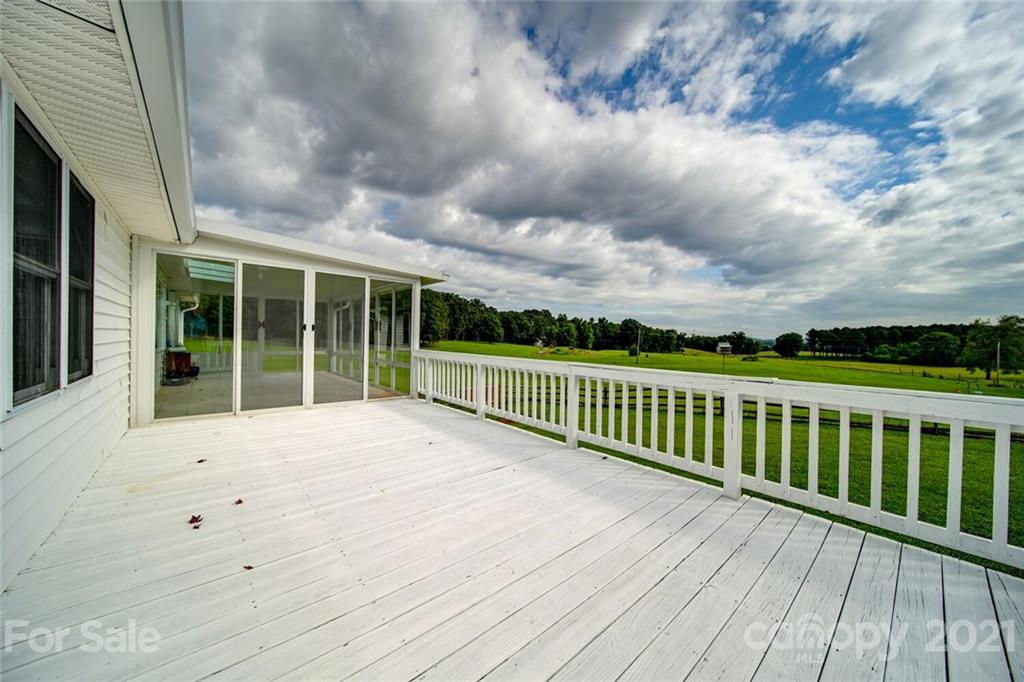 6460 Talley Road Stanfield, NC 28163 - Photo 46 of 47 a view of balcony with wooden floor and fence