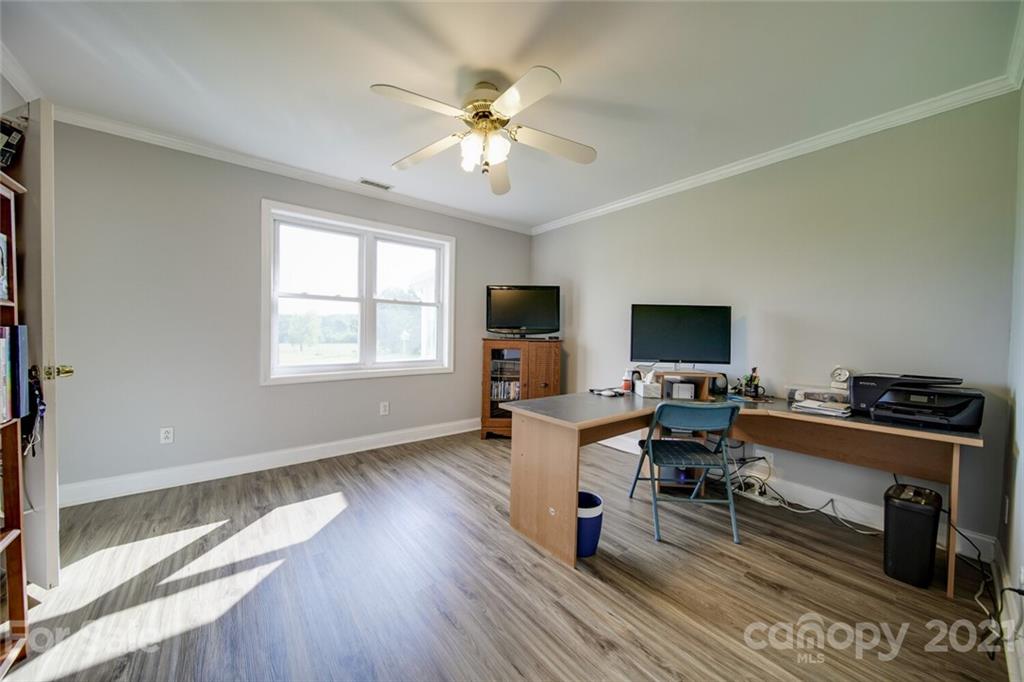 6460 Talley Road Stanfield, NC 28163 - Photo 7 of 47 a living room with furniture and a flat screen tv