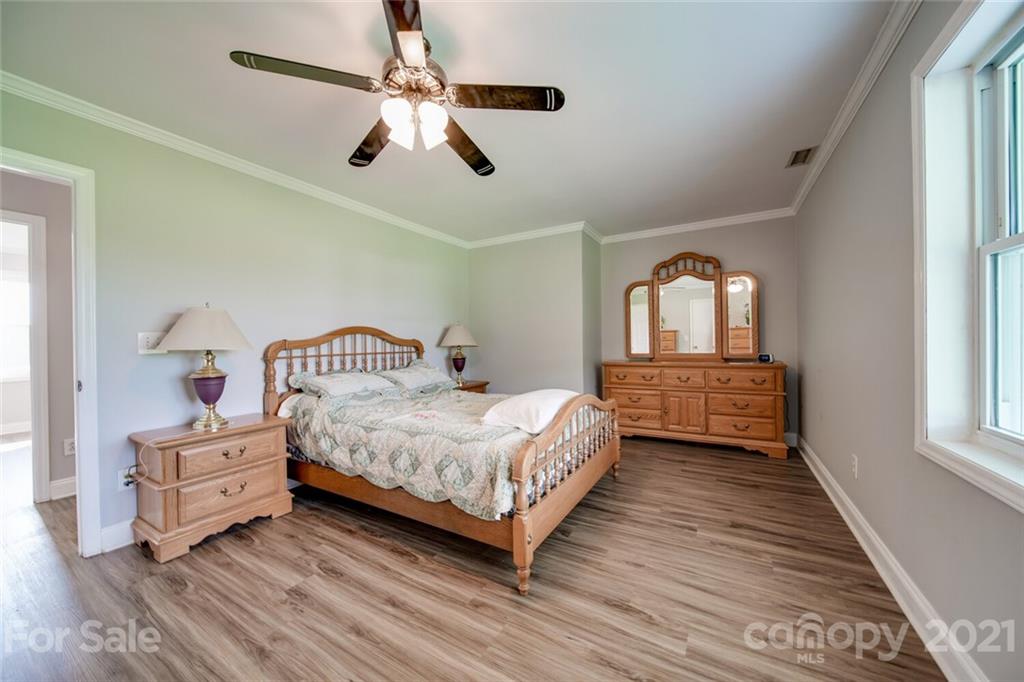 6460 Talley Road Stanfield, NC 28163 - Photo 8 of 47 a bedroom with a bed and window