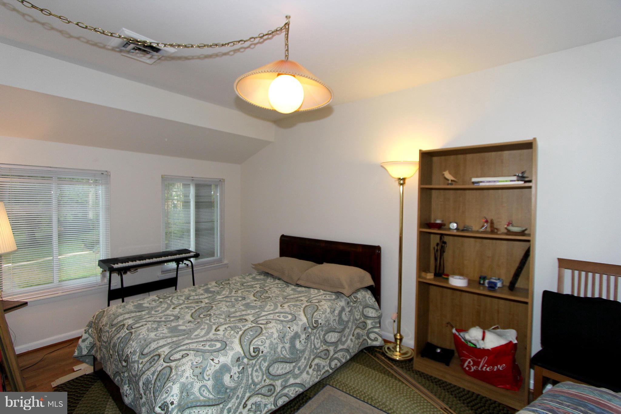 11051 Saffold Way Reston, VA 20190 - Photo 16 of 18 a bedroom with a bed and a window