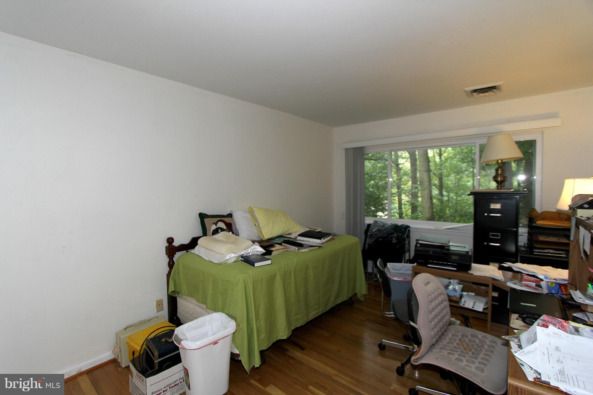 11051 Saffold Way Reston, VA 20190 - Photo 17 of 18 a bedroom with furniture and a window