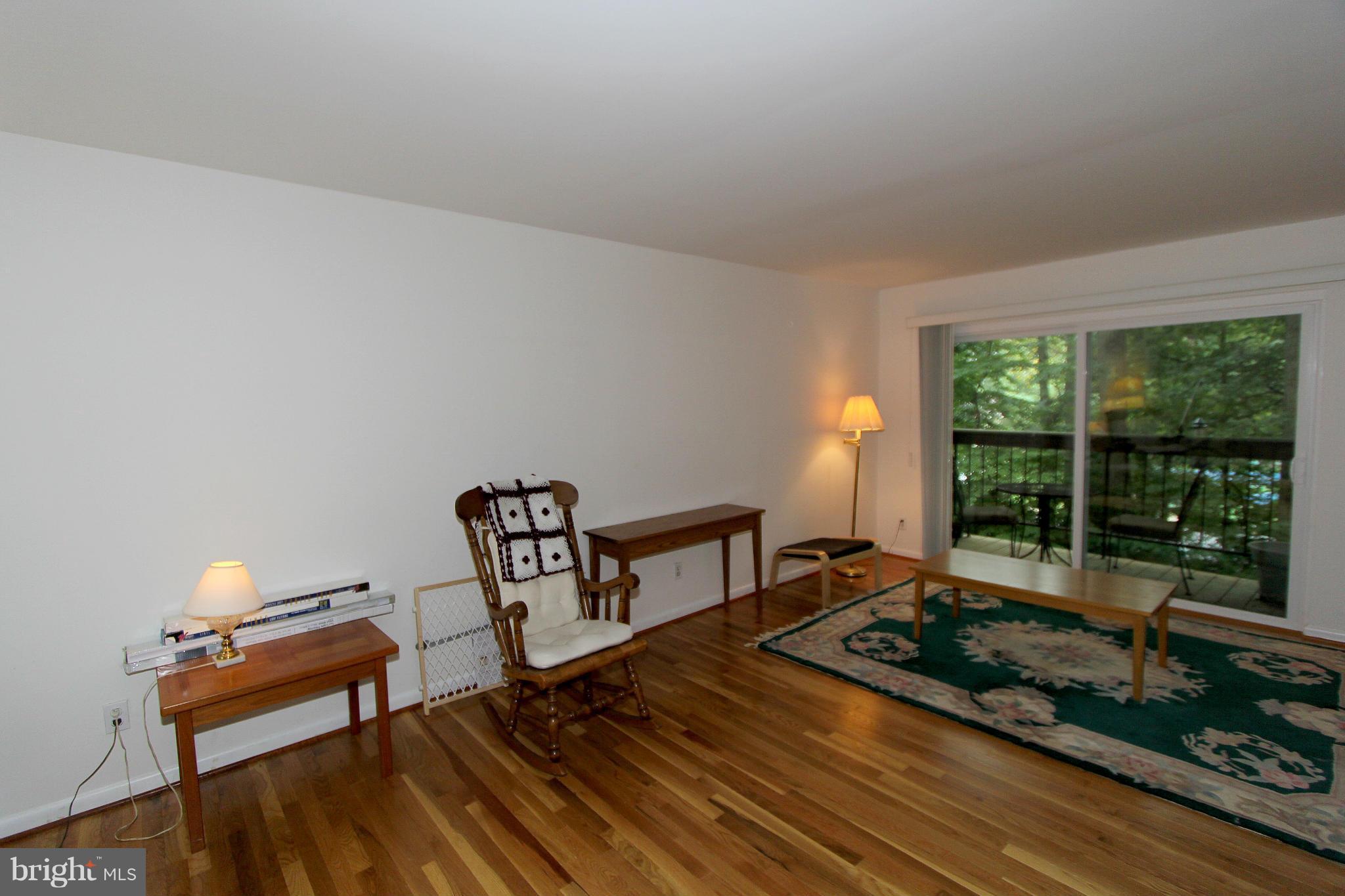 11051 Saffold Way Reston, VA 20190 - Photo 5 of 18 a bedroom with furniture and a window