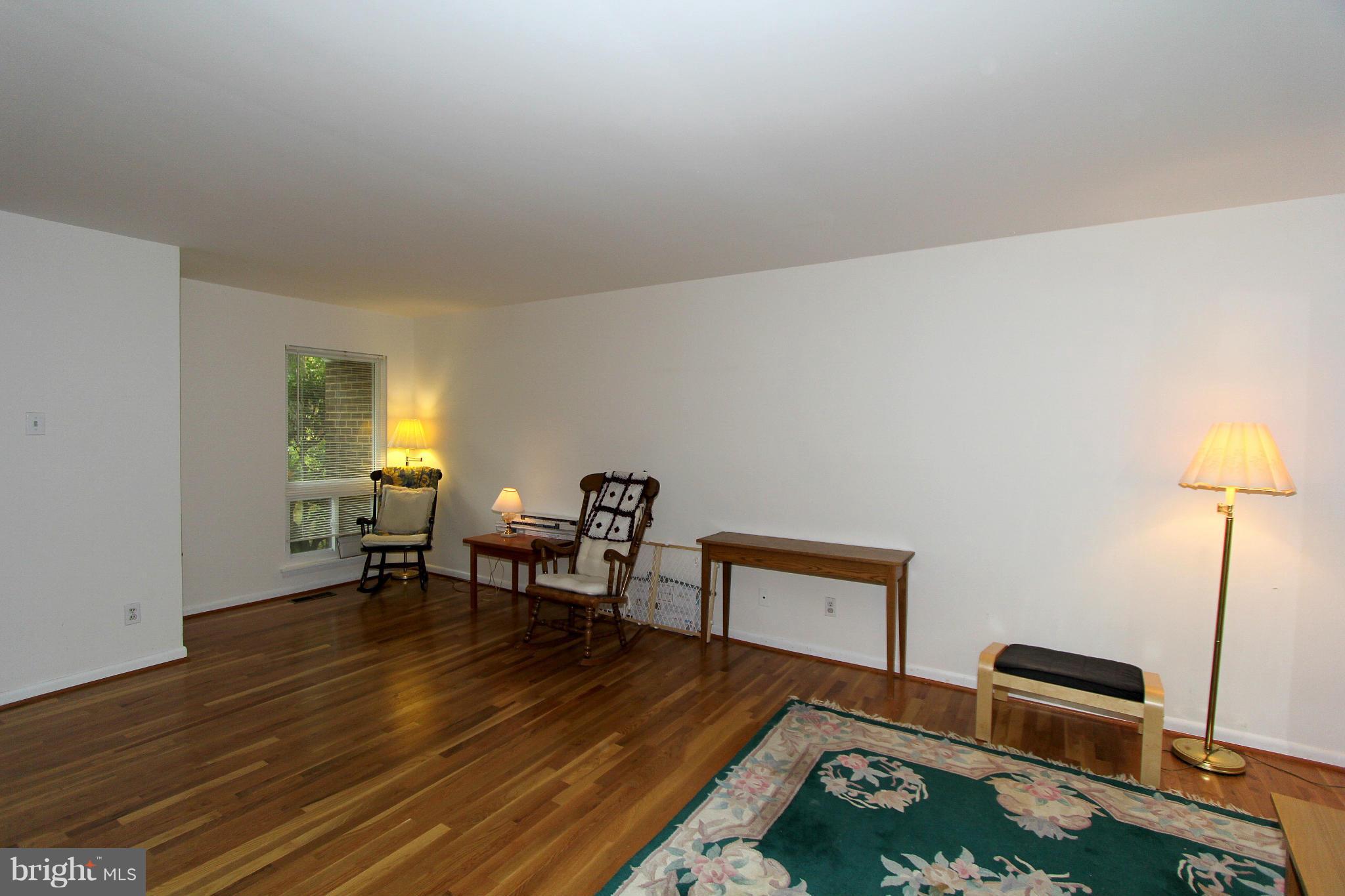 11051 Saffold Way Reston, VA 20190 - Photo 6 of 18 a living room with furniture