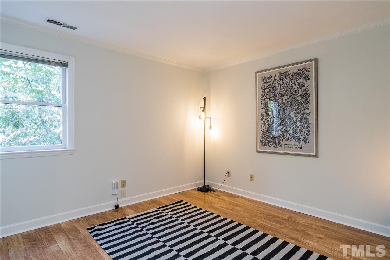 7010 Sandy Forks Road, Unit 207 Raleigh, NC 27615 - Photo 18 of 27 a view of a room with wooden floor and window
