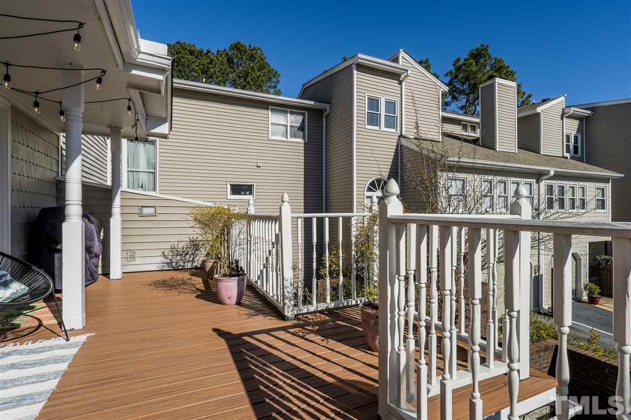 7010 Sandy Forks Road, Unit 207 Raleigh, NC 27615 - Photo 3 of 27 a view of a balcony with wooden floor and fence