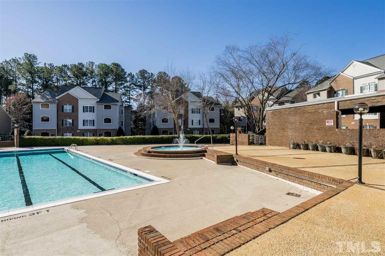 7010 Sandy Forks Road, Unit 207 Raleigh, NC 27615 - Photo 27 of 27 a view of outdoor space with swimming pool and seating