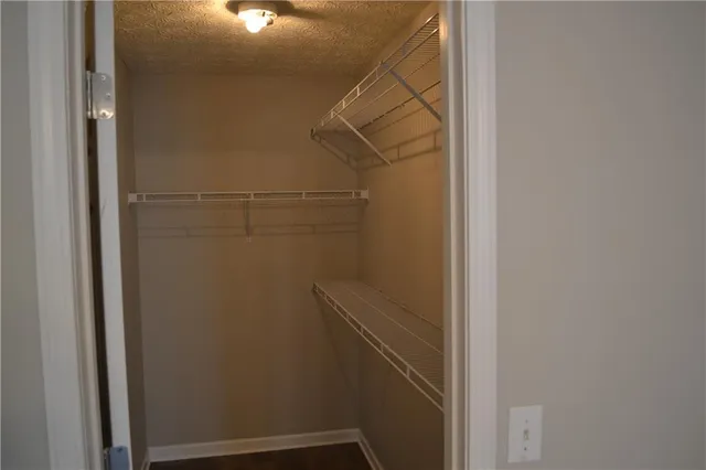 a view of storage and utility room with racks on the wall