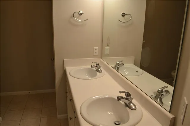 a bathroom with a sink and mirror