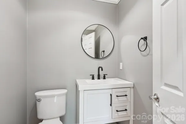 a bathroom with a sink a mirror and a shower